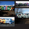 Four buses, each covered with vibrant graffiti inspired by NYC and Graffantasy, feature bold lettering and unique designs—like a cartoon character, flames, and abstract shapes—in KOLORSTORM by Schiffer Publishing, Ltd.