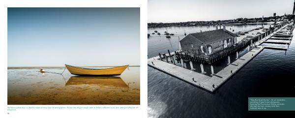 A yellow rowboat rests on a tranquil shore as a black-and-white aerial photo from "Art from above Cape Cod" by Schiffer Publishing, Ltd. reveals a harbor building, docks, boats, and shoreline beneath a clear sky.