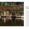 A modern glass and wood house by a tranquil pond is featured in "Anatomy of a Great Home" from Schiffer Publishing, Ltd. Two people relax on a dock, with text displayed on the right side of the image.