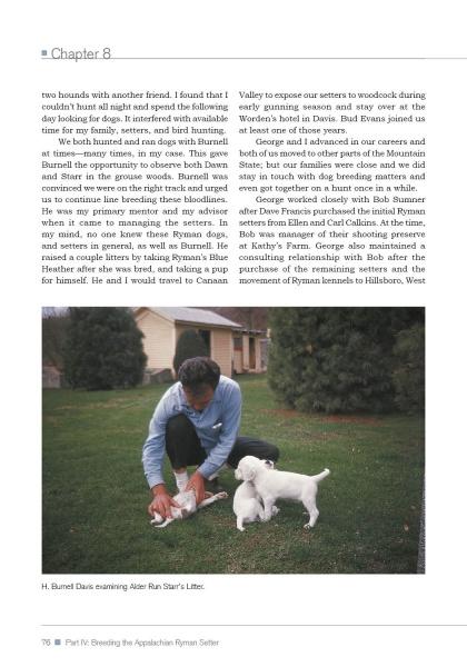 A man in blue kneels on grass, petting two white setters, with a white house and trees behind him. Featured: "The Real Ryman Setter: A History with Stories from the Appalachian Grouse Covers" by Schiffer Publishing, Ltd.