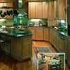 Discover stunning kitchen ideas from "Great Kitchens" by Schiffer Publishing, Ltd., featuring light wood cabinets, dark countertops, a center island, stainless steel appliances, and smart storage solutions like a wine rack and green bar stools.