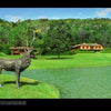 A bronze deer statue by a pond decorates a green lawn, with a large wooden house inspired by The Art of Brazilian Architecture from Schiffer Publishing, Ltd., and trees in the background under a partly cloudy sky.