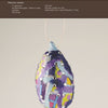 One Gourd at a Time" by Schiffer Publishing, Ltd. shows how to craft a painted gourd ornament decorated with colorful paper, blue paint, and flat-back crystals. Step-by-step instructions and materials are provided above the image.