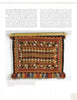 The Native American Horse Gear by Schiffer Publishing, Ltd. is a rectangular saddle blanket inspired by 19th-century styles, with geometric diamond and triangle patterns in warm orange, red, brown, and beige tones, and fringed along the bottom edge.