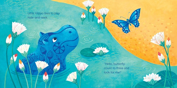 Little Hippo, inspired by the Egyptian hippopotamus figurine at the Louvre, hides among white flowers and lily pads under a yellow sky, watching a blue butterfly. Text reads: Hide-and-Seek with Little Hippo by Schiffer Publishing, Ltd.