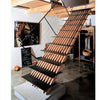 The book "Stairways" by Schiffer Publishing, Ltd. features contemporary designs, including a modern wooden staircase with open risers and metal railings connecting a loft in a minimalist, art-adorned room.