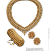 The Monet set by Schiffer Publishing, Ltd. includes a gold textured leaf collar necklace, a cuff bracelet, and floral cluster earrings, all displayed on a white background.