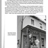 A black-and-white photo of a two-story house with a porch, balloons on the railing, and a "The Ghost Hunter Store" sign. According to Supernatural Mid-Atlantic by Schiffer Publishing, Ltd., it’s among the region’s most haunted locations.