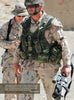Two soldiers in desert camo stand outdoors. A U.S. Marine with sunglasses and helmet holds a rifle; military knives, featured in "Modern Knives in Combat" by Schiffer Publishing, Ltd., are attached to his tactical vest. Sandy background.