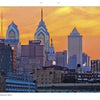 A sunset sky glows orange behind Philadelphia’s skyline of tall spires and modern towers—perfect inspiration captured in "Philadelphia" by Schiffer Publishing, Ltd.