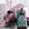 Two pairs of eyeglasses in colorful Knot Design cases by Schiffer Publishing, Ltd.—one pink and brown, one turquoise and brown—rest on a closed pink notebook beside clear glasses on a silver textured surface.