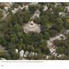 An aerial view of a circular building with a white cross and dome, nestled among trees and houses—an iconic scene captured in "Martha's Vineyard Perspectives" by Schiffer Publishing, Ltd.