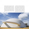 A modern white dome building stands against a blue sky with a flat tan walkway. Beside it, text notes its architectural significance and the "Igloo" book by Schiffer Publishing, Ltd., which explores contemporary igloo-inspired design.