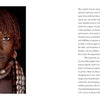 A portrait from the Daasanach tribe in Ethiopia, adorned with traditional jewelry and beads, faces the camera with a neutral gaze. Featured in "Human Tribe" by Schiffer Publishing, Ltd., text about Introduction appears on the right.