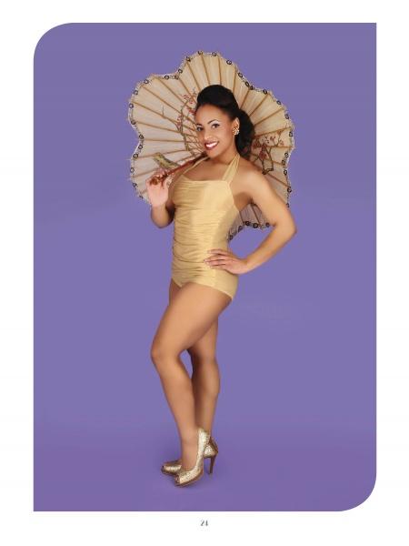 A woman beams confidently in a gold vintage-style swimsuit and heels, holding a parasol against a purple backdrop—capturing the timeless Black glamour showcased in "Chocolate Cheesecake 2" by Schiffer Publishing, Ltd.