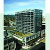 The award-winning Green Roof Designs by Schiffer Publishing, Ltd. features modern residential buildings with glass balconies and lush green roofs, illustrating innovative living architecture in urban settings under clear skies.