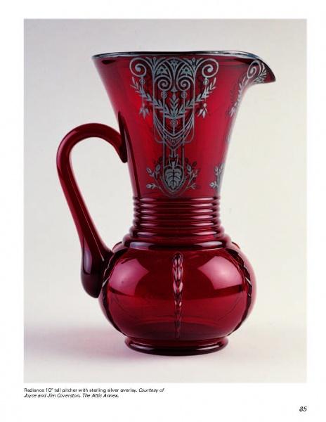 A striking vintage piece from Mauzy's Rare, Unusual, & Unique Depression Glass by Schiffer Publishing: a tall, deep red glass pitcher with ornate handle and silver overlay, beautifully displayed against a plain white background.