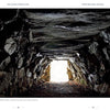 Discover the secrets of the Hudson Valley with "Hudson Valley History and Mystery" by Schiffer Publishing, Ltd.—explore ancient stone chambers illuminated by sunlight, where rough walls and scattered leaves hint at untold stories.
