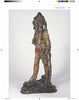 An impressive example of Antique Vienna Bronzes from Schiffer Publishing, Ltd., this bronze figurine depicts a Native American man in traditional attire with a feathered headdress, holding a bow and arrows, posed on a rocky base against a plain background.