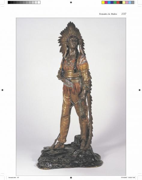 An impressive example of Antique Vienna Bronzes from Schiffer Publishing, Ltd., this bronze figurine depicts a Native American man in traditional attire with a feathered headdress, holding a bow and arrows, posed on a rocky base against a plain background.