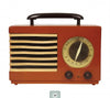 The Schiffer Publishing, Ltd. Retro Radio features a vintage red design with a black handle, gold speaker grille, large tuning dial, and two black front knobs—ideal for classic radio enthusiasts.