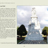A tall white marble memorial statue stands in a cemetery with trees and gravestones. Featured in Schiffer Publishing, Ltd.'s "Long Island's Most Haunted Cemeteries," it attracts ghost hunters and fans of paranormal investigations.