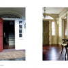 Left: The Americana book by Schiffer Publishing, Ltd. shows a red door to a colonial-style house with woven doormat and staircase. Right: A sunlit hallway with wood floors, chair, and arched windows captures Long Island country charm.