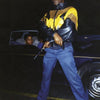 Greg Batman Davis by Schiffer Publishing, Ltd. features a confident figure in a leather and yellow jacket, gun in hand, with two women in a dark car behind him at night, capturing the aura of an Original Gangster.