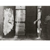 She Shoots Men by Schiffer Publishing, Ltd.: A black and white photo captures an intimate nude male figure in a narrow doorway, framed by textured walls as window light casts dramatic shadows.