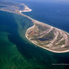 Stunning aerial view of Monomoy National Wildlife Refuge, as featured in "Cape Cod & the Islands Reflections" by Schiffer Publishing, Ltd.—crescent-shaped shores, vivid waters, and lush landscapes capture Cape Cod’s natural beauty.