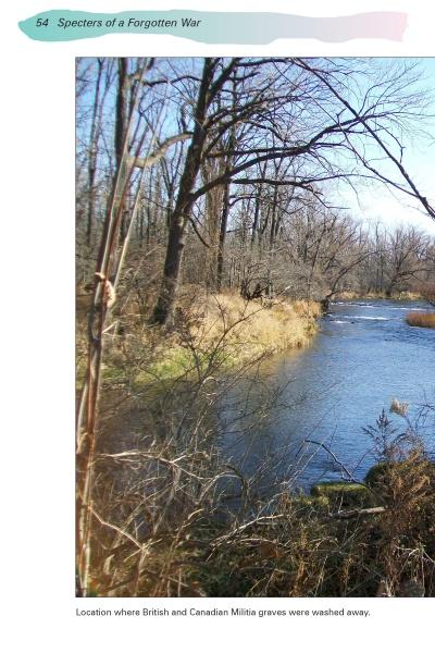 A river flows by leafless trees and dry grass beneath a clear sky. The scene recalls the tale from Schiffer Publishing, Ltd.'s Ghosts of Buffalo, where British and Canadian graves washed away—one of the city’s many haunted stories.