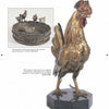 The Antique Vienna Bronzes by Schiffer Publishing, Ltd. feature a detailed rooster sculpture on an octagonal base, with four chickens on a barrel rim and a chick inside, evoking classic Vienna bronze artistry.