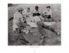 Five men in cowboy hats play cards on a blanket in a grassy field, with jackets and gear nearby, capturing the relaxed spirit of the American West in Harvey Caplin's Real Cowboys & the Old West by Schiffer Publishing, Ltd.