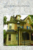 A charming Victorian cottage with ornate trim and a two-story bay window, often seen on Cape May Walking Tours by Schiffer Publishing, Ltd., stands behind a streetlamp and green trees on a bright day.