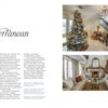 A magazine spread from "Christmas by Design" by Schiffer Publishing, Ltd. showcases festive holiday décor in a Mediterranean home, including a grand staircase with a Christmas tree, a cozy fireplace, and another tree by tall windows.