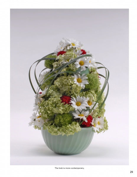 Creating Floral Centerpieces" by Schiffer Publishing, Ltd. showcases modern floral design with rounded arrangements of white daisies, green hydrangeas, red blooms, and looping green foliage in a pale green vase.