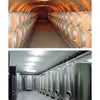 Top: Designing Wine Cellars by Schiffer Publishing, Ltd. features wooden barrels in classic stone cellars, while the bottom showcases modern wine storage with stainless steel tanks in a well-lit facility.