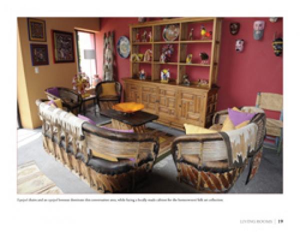 Inspired by Colores: Mexican Interiors from Schiffer Publishing, Ltd., this cozy living room features colorful walls, wood furniture, and a pottery-filled hutch, with woven accents and art for an authentic, vibrant Mexican style.