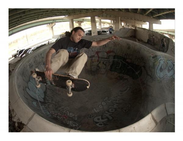 A man skateboards in a pool at FDR Skatepark, featured in "FDR Skatepark: A Visual History" by Schiffer Publishing, Ltd., highlighting this legendary D-I-Y park built by the skateboarding community.