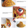 A four-photo collage features a handmade golden tiara from "Making Gourd Headpieces" by Schiffer Publishing, Ltd., decorated with gems and the words "Relax, I’m in Charge." A hand displays the unique gourd headpiece in two images.