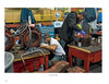 Two factory workers repair machine parts at cluttered benches, echoing the behind-the-scenes work that keeps Boston’s MBTA running—just like the stories shared in "Boston Below" by Schiffer Publishing, Ltd.