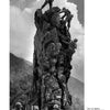 In Bodine's Industry by Schiffer Publishing, Ltd., soldiers in uniform scale a jagged rock with ropes, one standing victorious atop—echoing classic American photography. Trees and clouds form a dramatic backdrop.