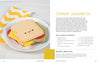 A plate with smiling felt sandwich pieces sits on a white surface beside a yellow-and-white chevron napkin. Featured in "Sewing Simple Softies with 17 Amazing Designers" by Schiffer Publishing, Ltd., perfect for hand-sewn projects. Instructions shown right.
