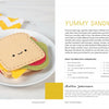 A plate with smiling felt sandwich pieces sits on a white surface beside a yellow-and-white chevron napkin. Featured in "Sewing Simple Softies with 17 Amazing Designers" by Schiffer Publishing, Ltd., perfect for hand-sewn projects. Instructions shown right.