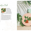 An open copy of Freshly Stitched by Schiffer Publishing, Ltd. displays a modern embroidery project with green plants in orange and white pots, alongside a succulent and geometric canvas art. The left page features text and patterns.