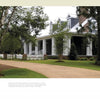 A spacious home with Southern architecture features a wide porch, brick steps, white pillars, and dormer windows behind a picket fence with lush greenery. Above is the text: Contemporary Southern Homes by Schiffer Publishing, Ltd.