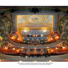 A vibrant wide-angle shot of a restored theater interior from "Along Route 7" by Schiffer Publishing, Ltd., features ornate balconies, golden accents, decorative ceiling, and rows of seats—capturing the charm of small-town Americana.