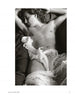 Inspired by Vivienne Maricevic, "She Shoots Men" by Schiffer Publishing, Ltd. features intimate black-and-white photos of men, like a partially nude man reclining on dark sheets, draped in sheer fabric, eyes closed, arm above his head.