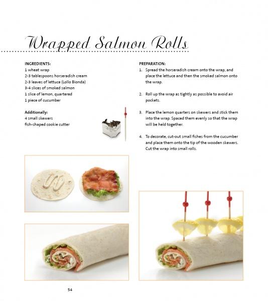 A recipe page from "Garnishing & Decorating" by Schiffer Publishing, Ltd. shows Wrapped Salmon Rolls as finger food with step-by-step photos: spreading horseradish, adding lettuce and salmon, rolling up, and finished rolls garnished with cucumber and skewers.