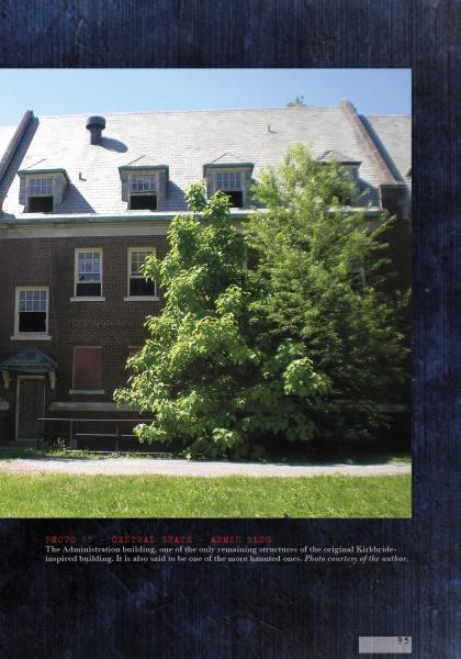 The weathered brick building with a steep gray roof, featured in "Lost in the Darkness" by Schiffer Publishing, Ltd., stands in sunlight, its abandoned, haunted-asylum look intensified by overgrown trees and an eerie, forgotten atmosphere.